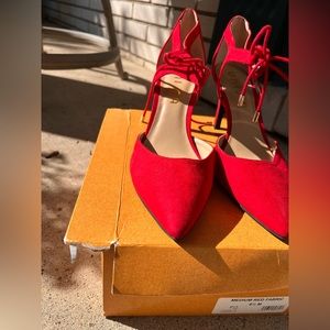 Red lace up heels with silver metal lace ends